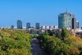 Bucharest, Romania panoramic city view from the Triumphal Arch with park and modern buildings in the background under a clear blue Royalty Free Stock Photo