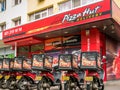 Bucharest/Romania - 06.22.2020: Pizza-Hut delivery motorcycles parked in front of the Pizza-Hut restaurant, in Bucharest Royalty Free Stock Photo