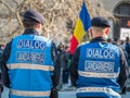 Police officers and Gendarmerie or military police closely supervising the demonstrators from