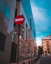 Traffic sign against a glass building Royalty Free Stock Photo