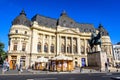 Bucharest, Romania, 25 September 2021: The Central University Library with equestrian monument to King Carol I in front of it in