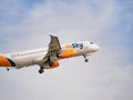 HiSky Airways Airbus A320-200 flying against blue sky. Airplane takes off from Henry Coanda