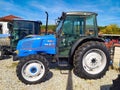 Bucharest, Romania - September 12, 2022: ISEKI Tractor TR63, Employees are presenting the use of a large-scale tractor