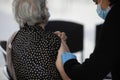 A senior woman is preparing to get the third dose of Pfizer Biontech anti Covid-19 vaccine in a mobile vaccination centre