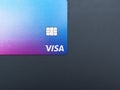 Visa credit or debit card on grey background. Online electronic commerce concept