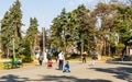 Bucharest, Romania - 2019. Young guys playing ball with kids