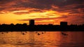 Bucharest sunset on Herastrau lake with kayak , people having relaxing and fun time