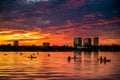 Bucharest sunset on Herastrau lake with kayak , people having relaxing and fun time