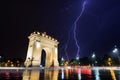 Bucharest Triumph Arch in the light storm by night Royalty Free Stock Photo