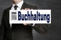 Buchhaltung in german Accounting signboard is held by business Royalty Free Stock Photo