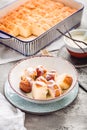 Buchteln, sweet rolls made of yeast dough with milk and butter, served with vanilla sauce