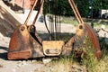 Bucket from the crane, lying on the ground. Repair crane