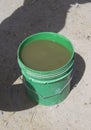 Bucket of dirty drinking water collected in African village is common place in Tanzania, Africa