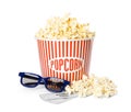 Bucket of fresh popcorn, tickets and 3D glasses on background. Cinema snack Royalty Free Stock Photo