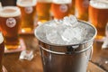 bucket with ice and beer, strategically placed in a craft brewery