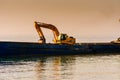 Bucket Loader In Vessel On Riprap Works