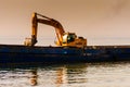 Bucket Loader In Vessel On Riprap Works