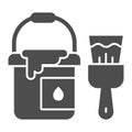 Bucket of paint and brush solid icon, house repair concept, building painter tools sign on white background, paint can