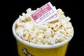 Bucket of popcorn with movie ticket Royalty Free Stock Photo