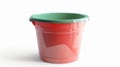 Red bucket green lid on white surface Royalty Free Stock Photo