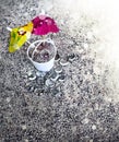 Bucket with sand and cocktail umbrella on beach Royalty Free Stock Photo