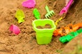 A bucket and a sand set for playing sand on the beach. Holidays with children at the sea. Games and entertainment for young Royalty Free Stock Photo