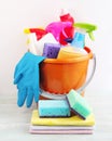 Bucket with a set of cleaning products for cleaning various surfaces in the kitchen, bathroom and other areas Royalty Free Stock Photo