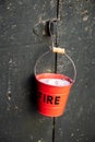 Bucket-shaped cigarette ashtray with the writing: Â«fireÂ» Royalty Free Stock Photo