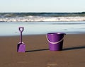 Bucket and spade on beach Royalty Free Stock Photo