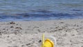 Bucket spade sandcastle Diggers and toys on sandy beach in the UK