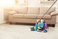 Bucket with sponges, chemicals bottles and mopping stick. Royalty Free Stock Photo