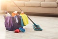 Bucket with sponges, chemicals bottles and mopping stick. Royalty Free Stock Photo