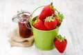 Bucket of strawberries on wooden table Royalty Free Stock Photo