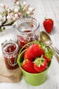 Bucket of strawberries on wooden table Royalty Free Stock Photo