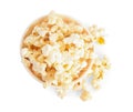 Bucket of tasty pop corn isolated on white, top view Royalty Free Stock Photo