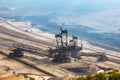 Bucket-wheel excavator mining lignite (brown coal) in mine Royalty Free Stock Photo