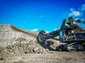 Bucket wheel excuvator is digging a soil in coal mine.