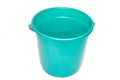 A bucket on a white background. Plastic green bucket on a white background. Bucket for washing floors. Royalty Free Stock Photo