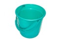 A bucket on a white background. Plastic green bucket on a white background. Bucket for washing floors. Royalty Free Stock Photo