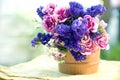 Bucket with wildflowers on the table outdoors Royalty Free Stock Photo