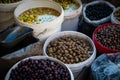 Buckets of olives for sale on Suq or street food market