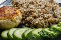 Buckwheat cereal with grilled chicken cutlet and slised cucumber Royalty Free Stock Photo