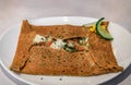 Buckwheat crepe with frog legs and tomatoes at a restaurant in Colmar, France Royalty Free Stock Photo