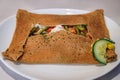 Buckwheat crepe with green beans and tomatoes at a restaurant in Colmar, France Royalty Free Stock Photo