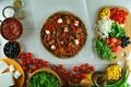 Buckwheat Crust Pizza with Tomato Sauce, Mushrooms, and Sliced Peppers An entire preparation process with final dish. Royalty Free Stock Photo