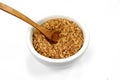 Buckwheat flakes in a bowl isolated on white background. Healthy buckwheat flakes. Healthy food.