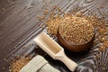 Buckwheat groats hulled seeds in wooden bowl. Superfood, healthy gluten-free food, pseudocereal Royalty Free Stock Photo