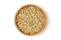 Buckwheat kernels in wooden bowl on white background