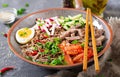 Buckwheat noodles with beef, eggs and vegetables. Korean food.