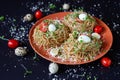 Buckwheat noodles with quail eggs, tomatoes and microgreen. Selective focus Royalty Free Stock Photo